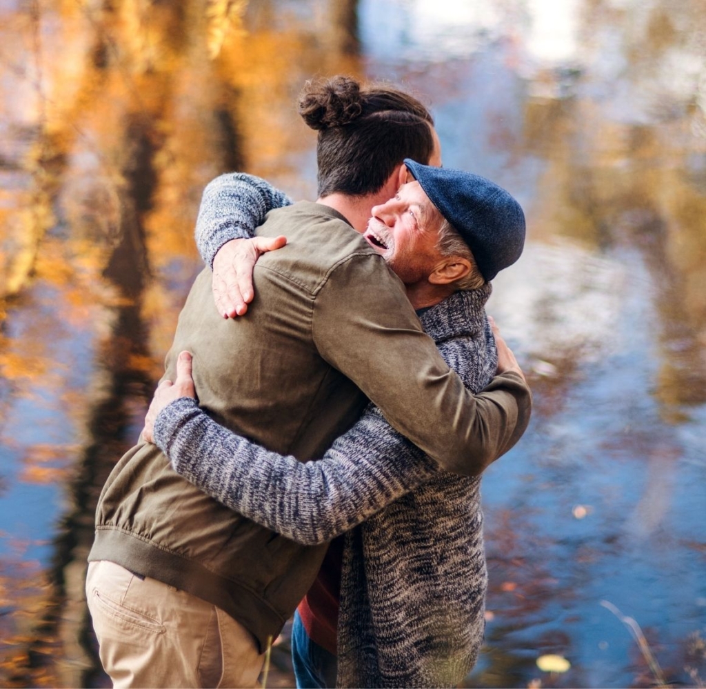 elderly hugging caregiver