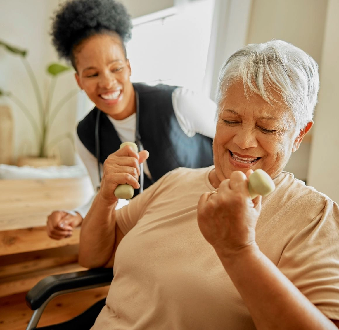 caregiver helping senior exercise