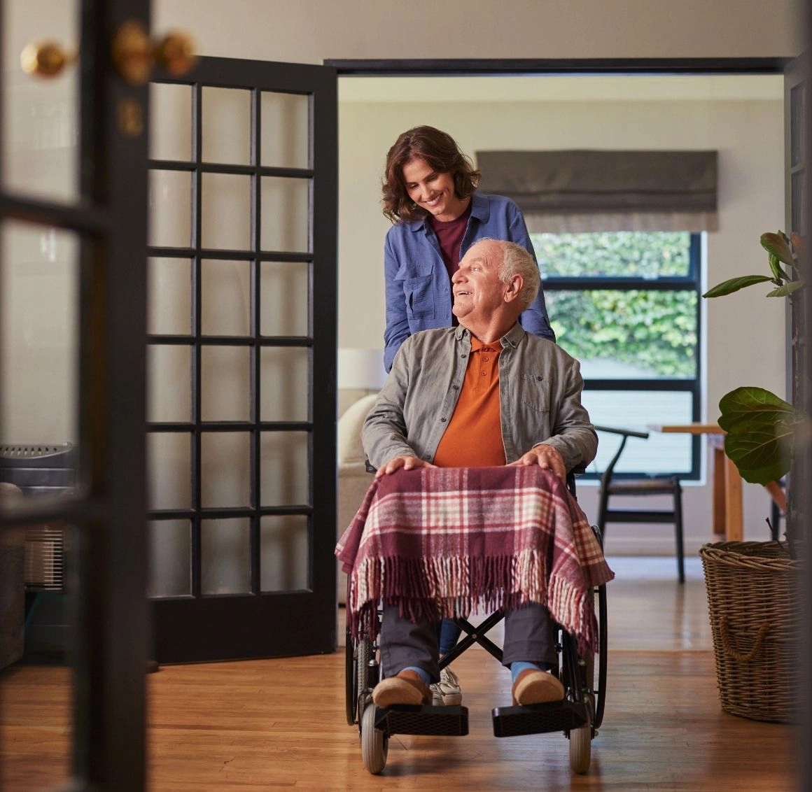 caregiver helping senior in his home